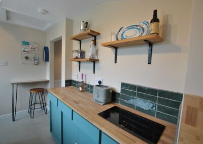 Wooden kitchen units and shelves.