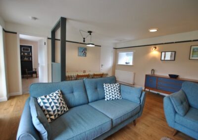 Dining area behind the sofas.