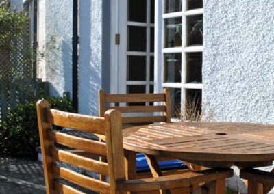 French doors beyond the round table on the patio.